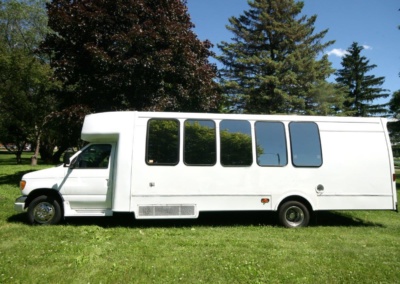 Limo Coach 22 Passenger Turtle Top Drivers Side View