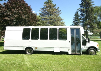 Limo Coach 22 Passenger Turtle Top Passenger Side View